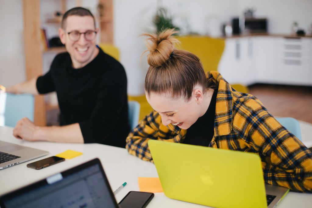 colleagues at work laughing